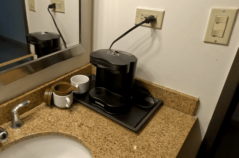 The "tea and coffee making set" is just the device! No coffee, no tea, just the device.
(The cups we borrowed from the restaurant down stairs and the filter we brought with us.)
