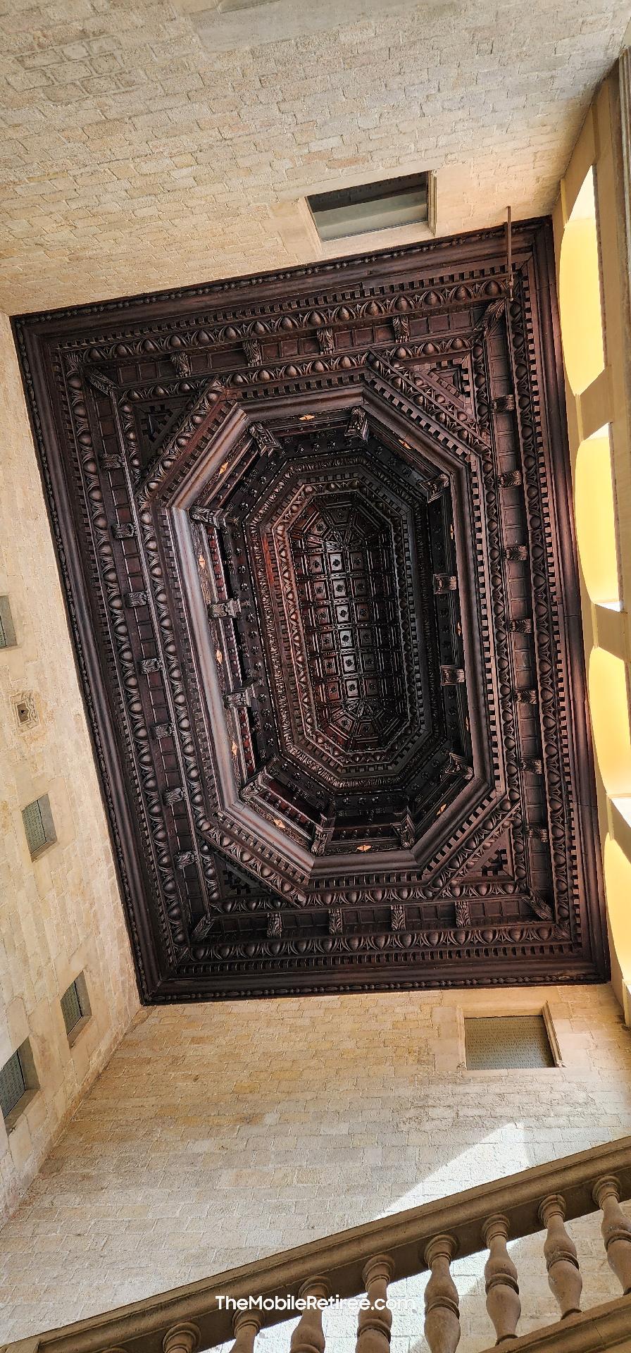 ornate coffered wood ceiling in the stairwell of the Palau del Lloctinent (Lieutenant’s Palace)