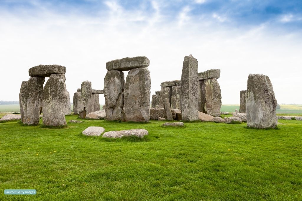  a picture of Stonehenge surrounded by green grass